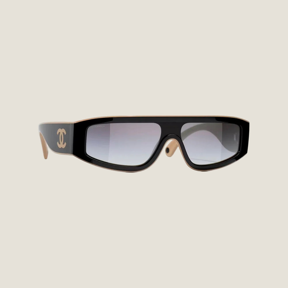 Black and brown CHANEL sunglasses with plastic frame and adjustable nose pads, offering 100% UVA/UVB protection.