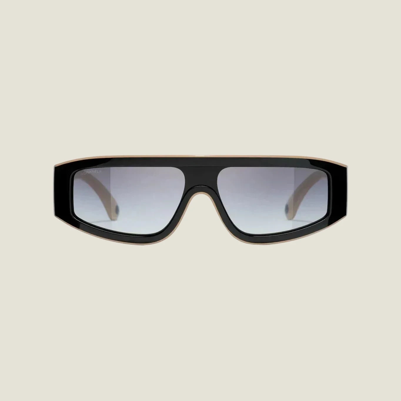 Image of Black and brown CHANEL sunglasses with plastic frame and adjustable nose pads, offering 100% UVA/UVB protection.