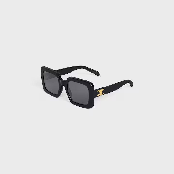 Image of Celine sunglasses with black square frames and gold logo detailing on the temples.