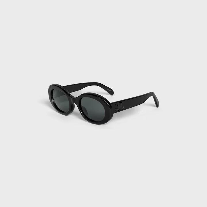 Image of Stylish oval black sunglasses with logo, elegant Parisian design by Celine.