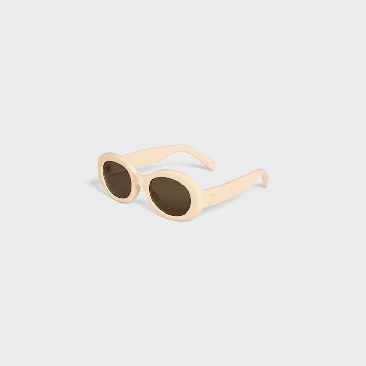 Image of Celine sunglasses with logo, elegant Parisian design, UV400 protection, beige frame, luxury style.