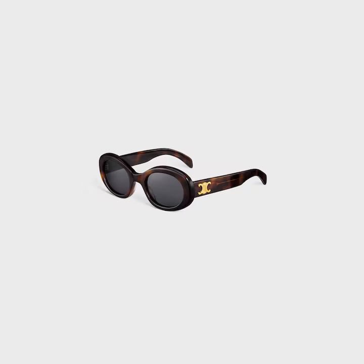 Celine sunglasses with dark lenses and a tortoiseshell frame featuring a gold logo "C".