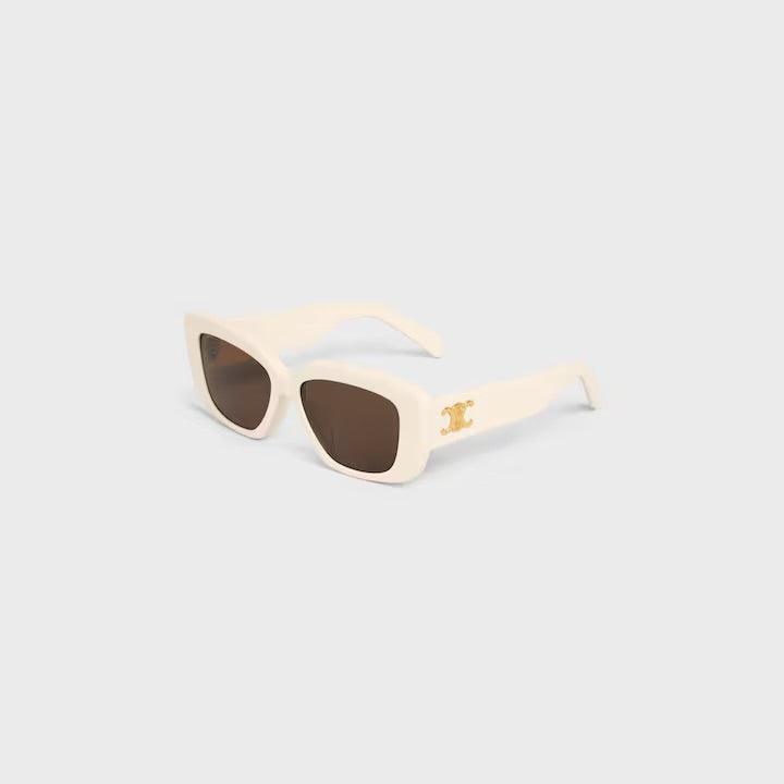 Image of Celine logo sunglasses with sleek white frames and dark lenses on a light grey background.