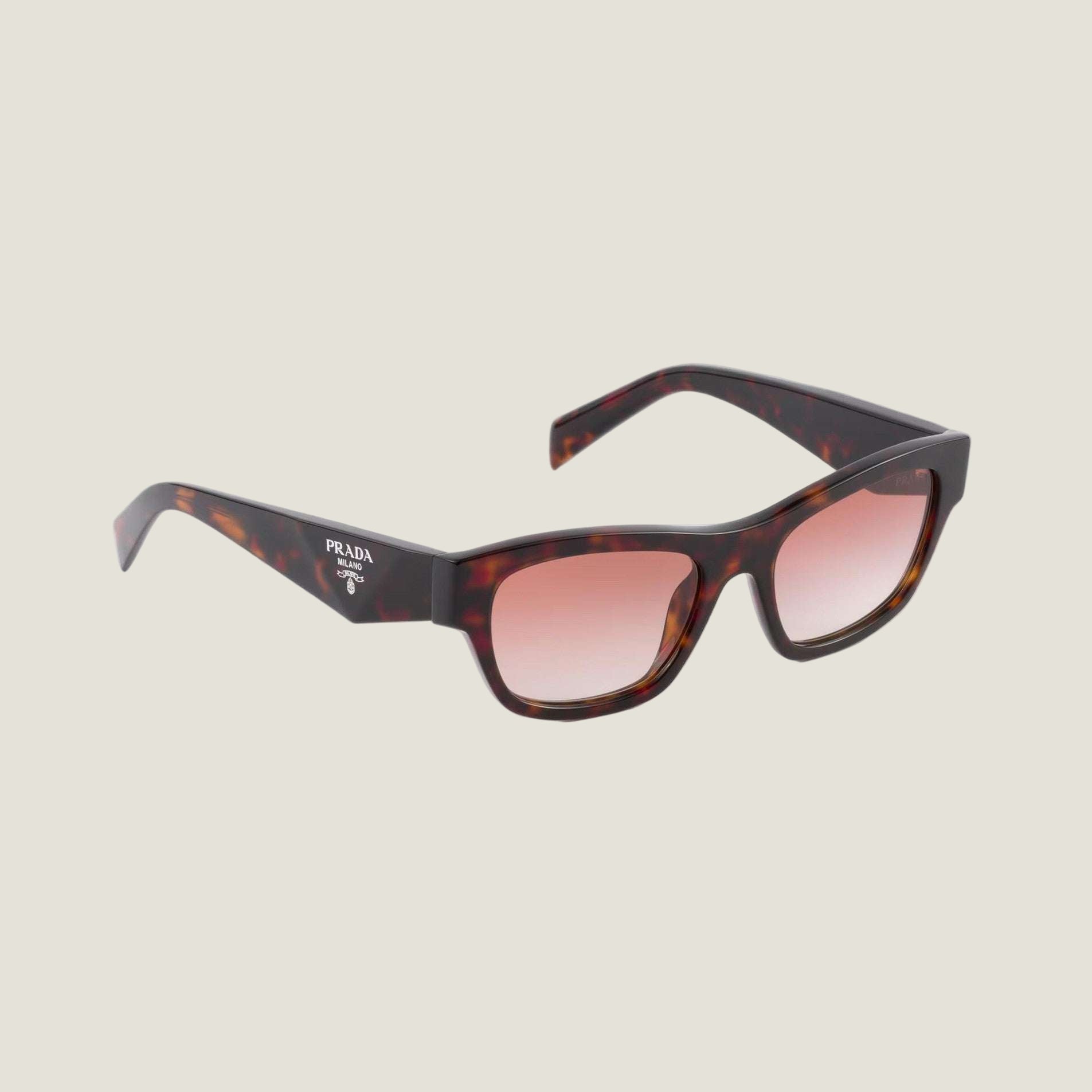 Prada sunglasses with bold logo and geometric frames, embodying luxury and modern elegance.