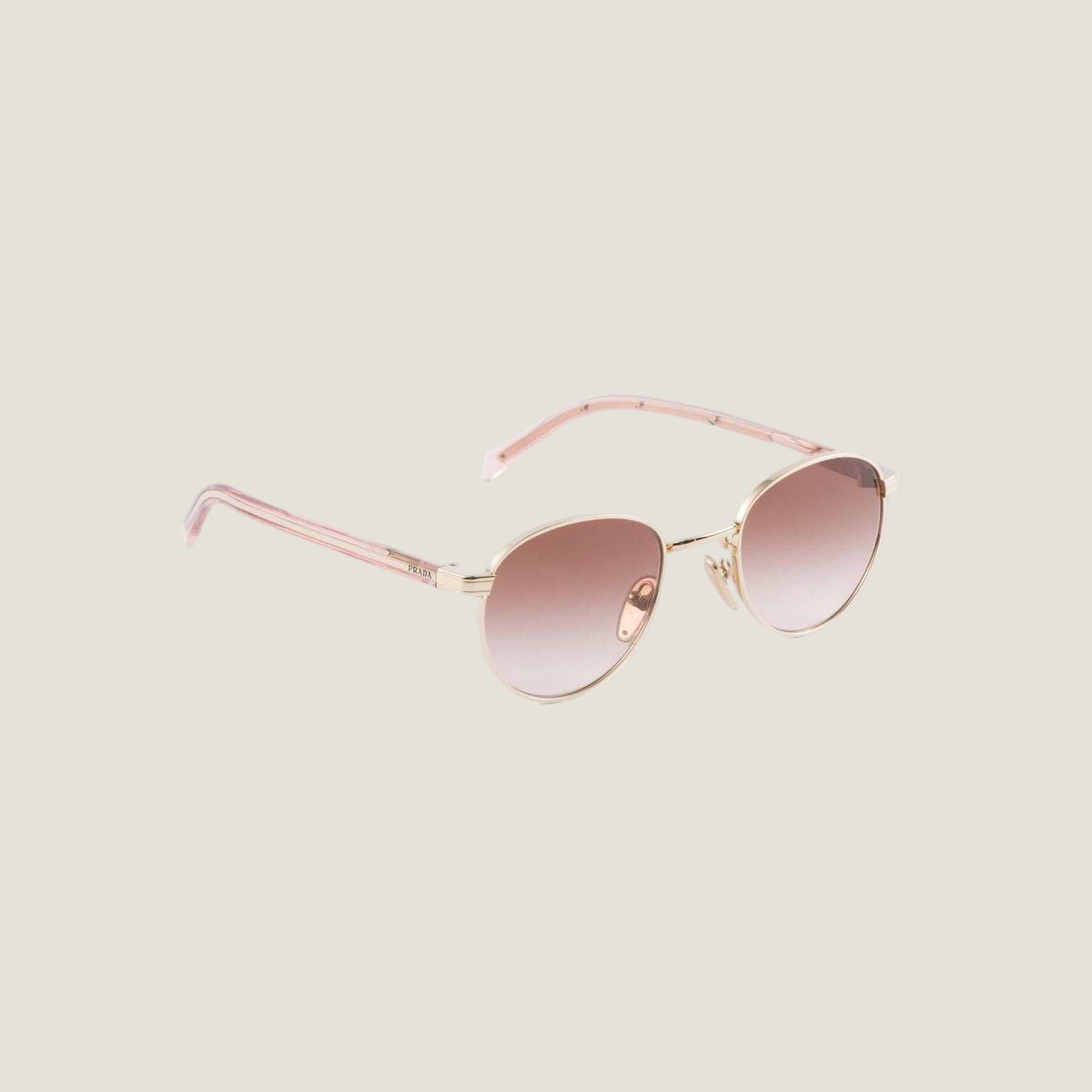 Luxury Prada sunglasses with geometric frames and bold logo, embodying elegance and Italian style.