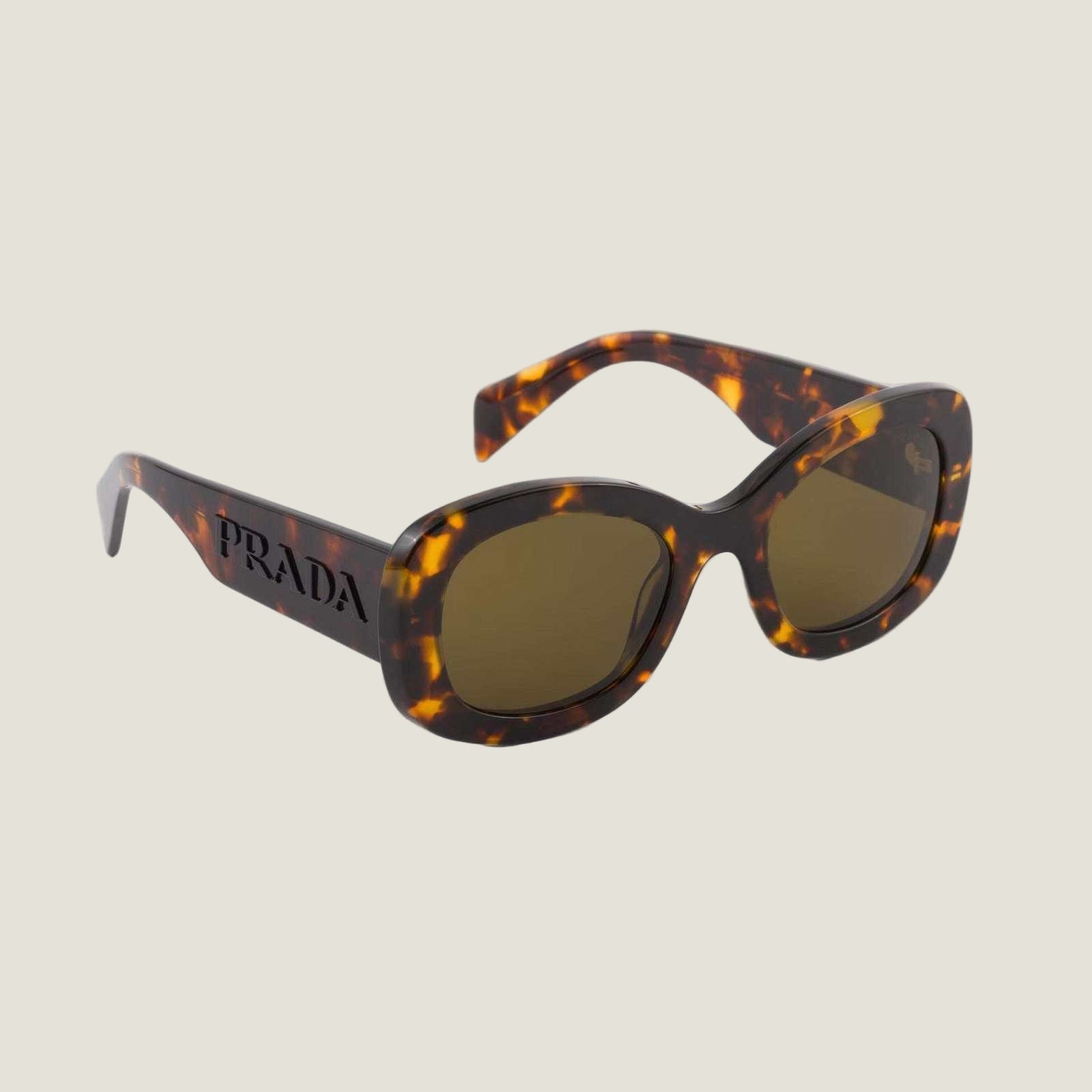 Image of PRADA logo sunglasses with bold geometric frames and dark lenses.
