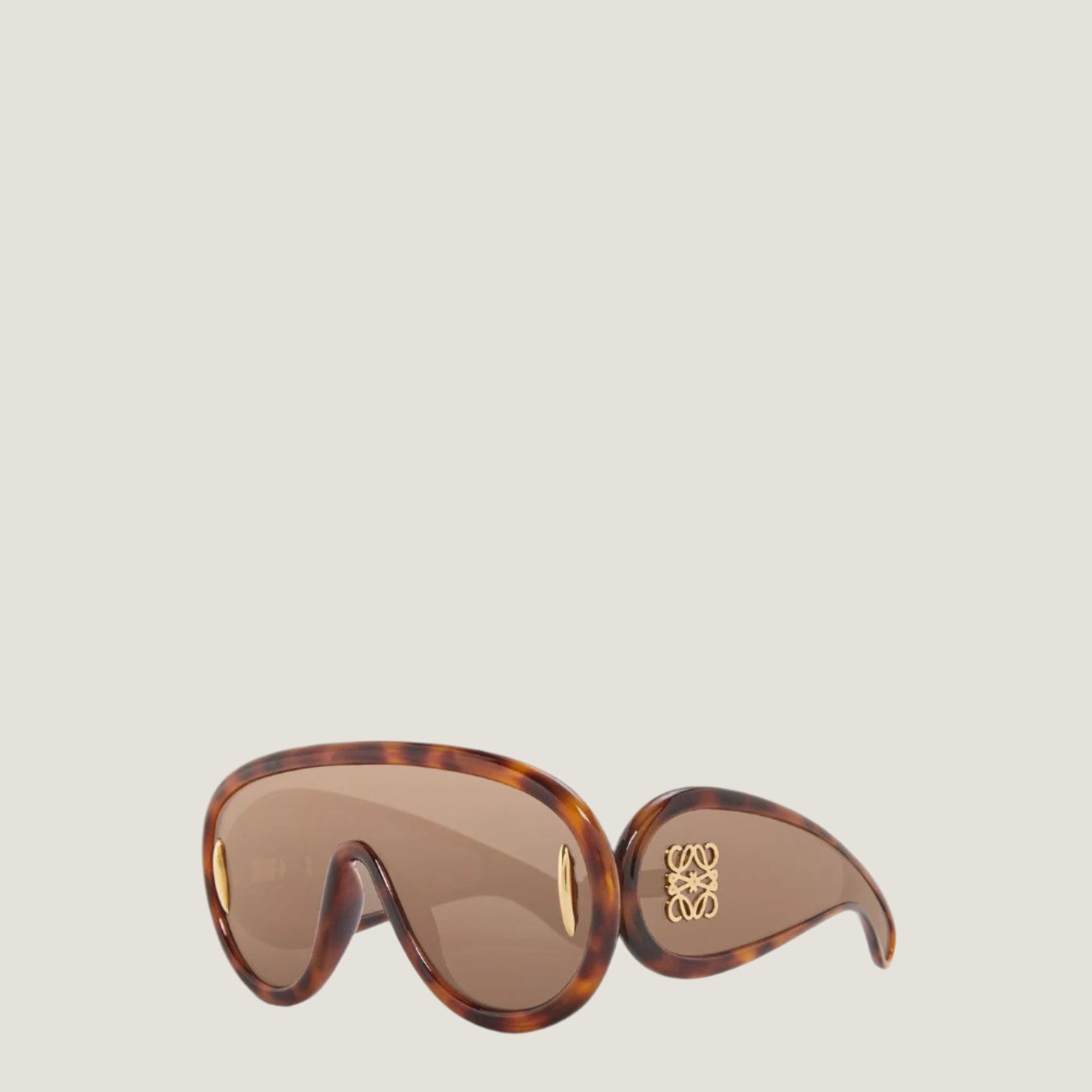 Image of Modern luxury LOEWE sunglasses with geometric frames and UV400 lenses.