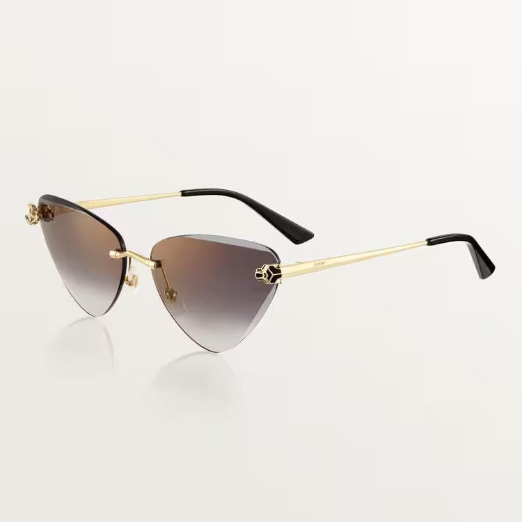 Image of Cartier sunglasses with gold metal frame and UV400 lenses.