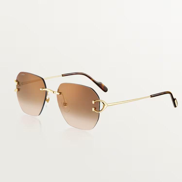 Cartier luxury sunglasses with gold-plated metal frame and UV400 protection lenses.