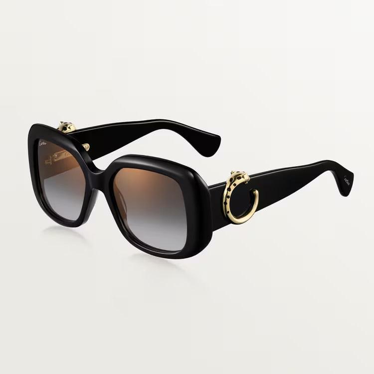 Luxury Cartier sunglasses with gold-plated metal frame, timeless unisex design, and UV400 protection.