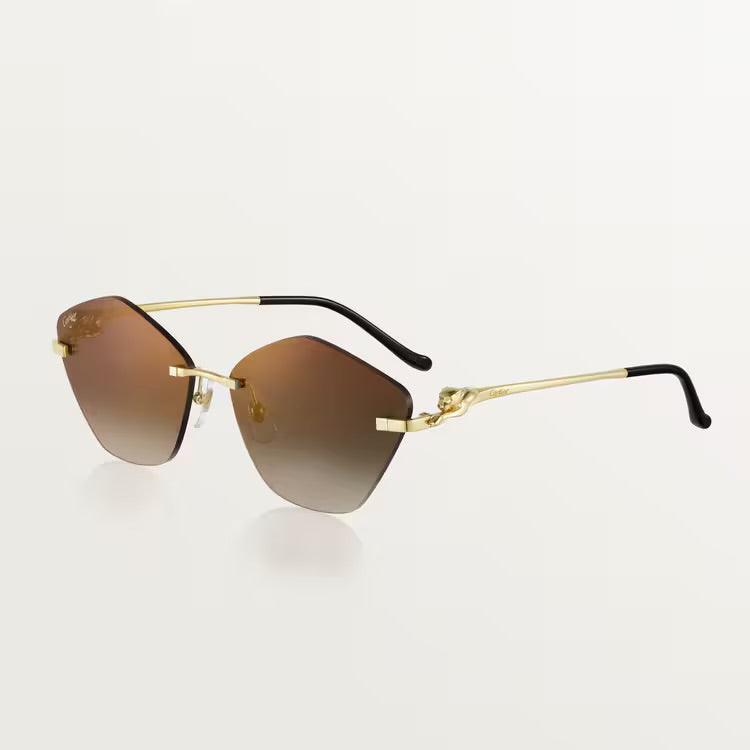 Cartier luxury sunglasses with gold metal frame and UV400 lenses for men and women.