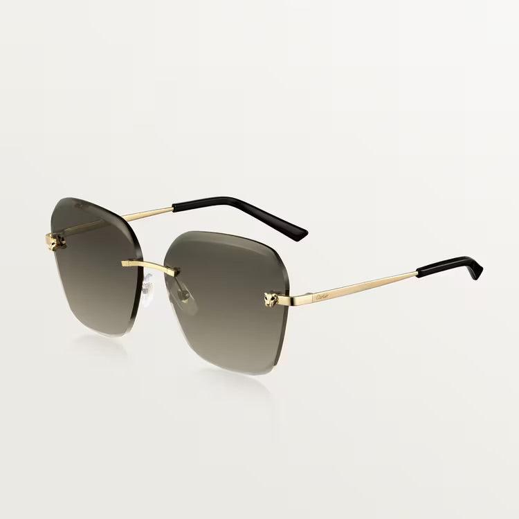 Cartier sunglasses with gold metal frame and UV400 lenses for luxury style and protection.