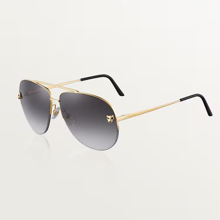Image of Cartier sunglasses with gold metal frame and UV400 dark lenses.