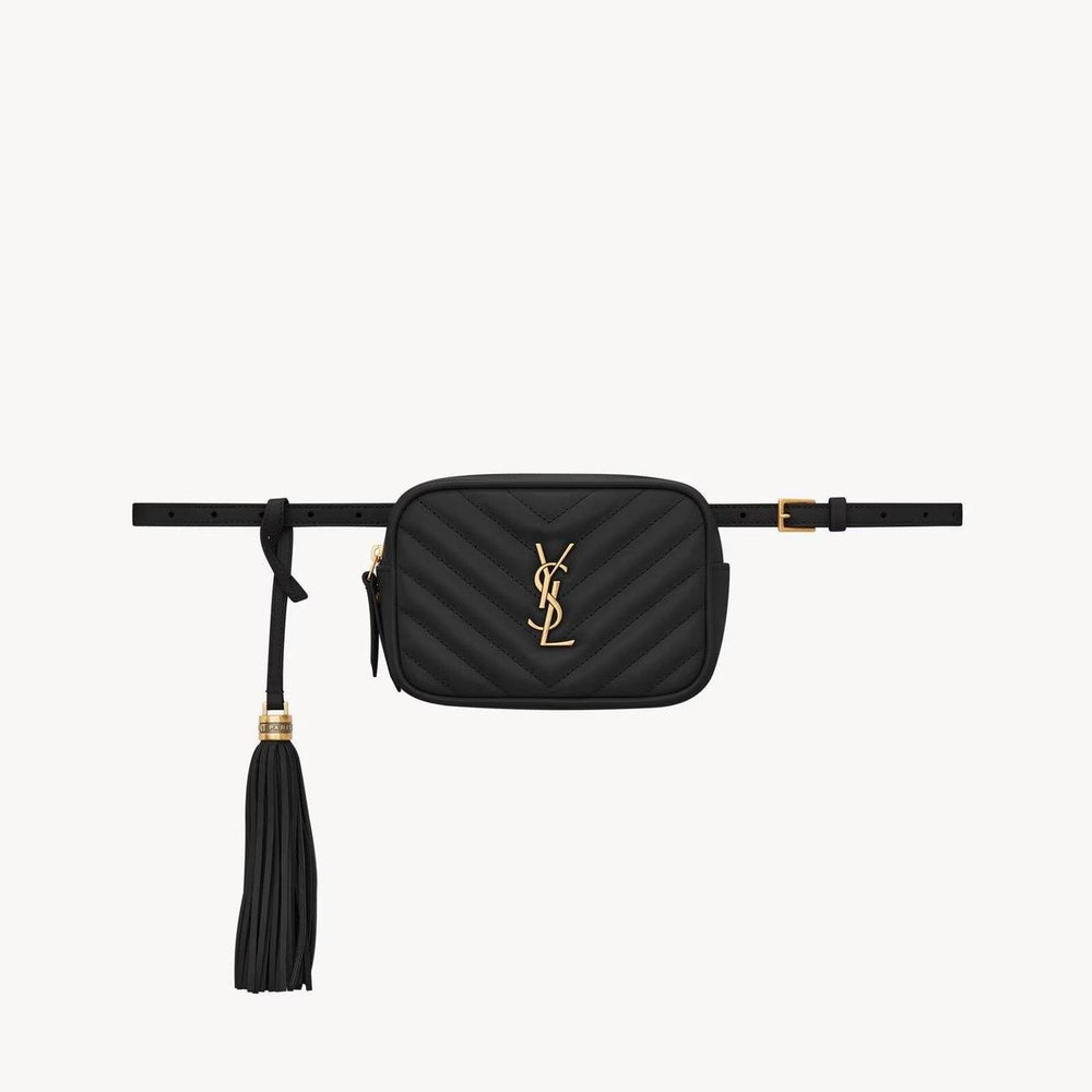 Luxury black Saint Laurent belt bag with gold logo and tassel detailing.
