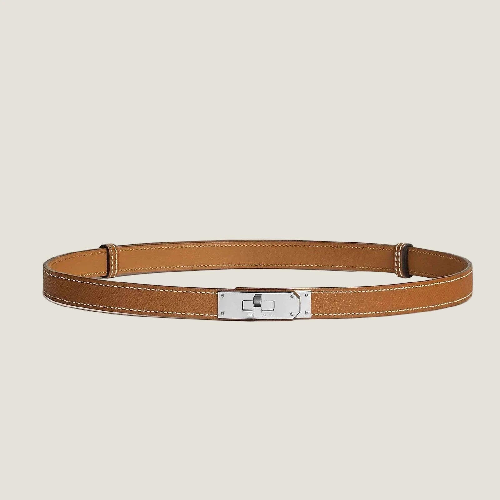Image of Hermes Kelly silver buckle belt in premium leather, minimalist design.