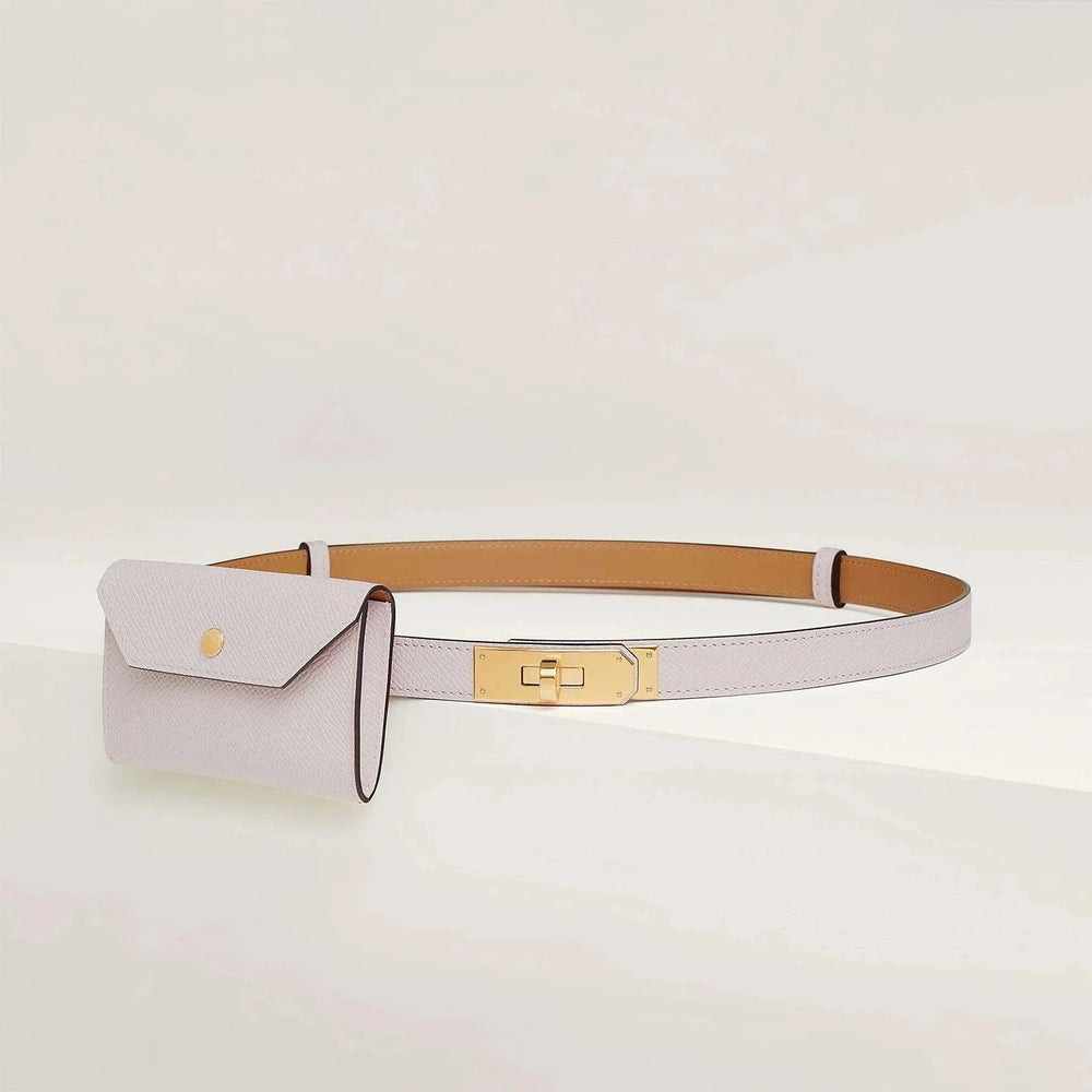 Hermès Kelly belt with minimalist design and golden metallic buckle.