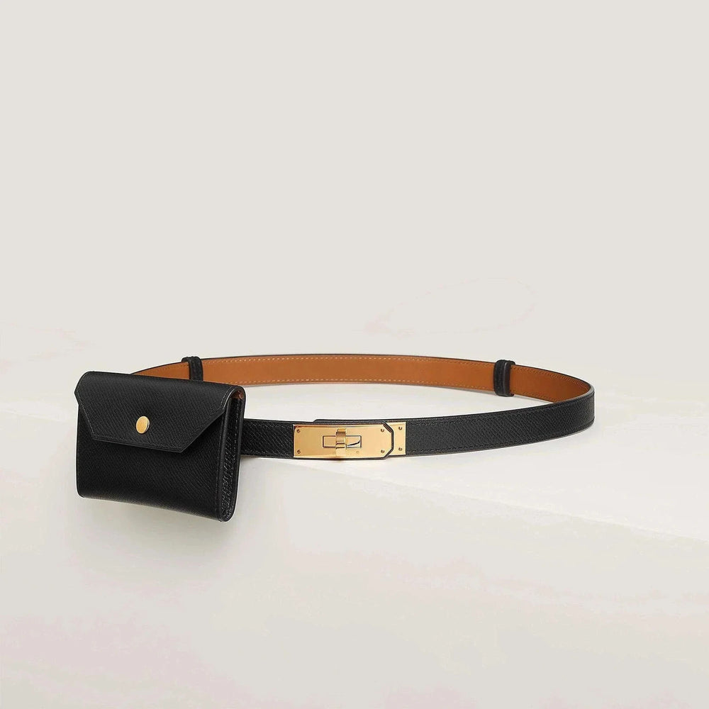 Hermès leather belt with gold buckle and black pouch, luxury fashion accessory.