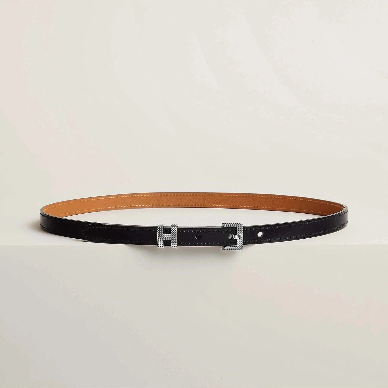 Image of Luxury Hermes belt in premium leather with sleek metallic buckle, minimalistic and elegant design for sophisticated style.