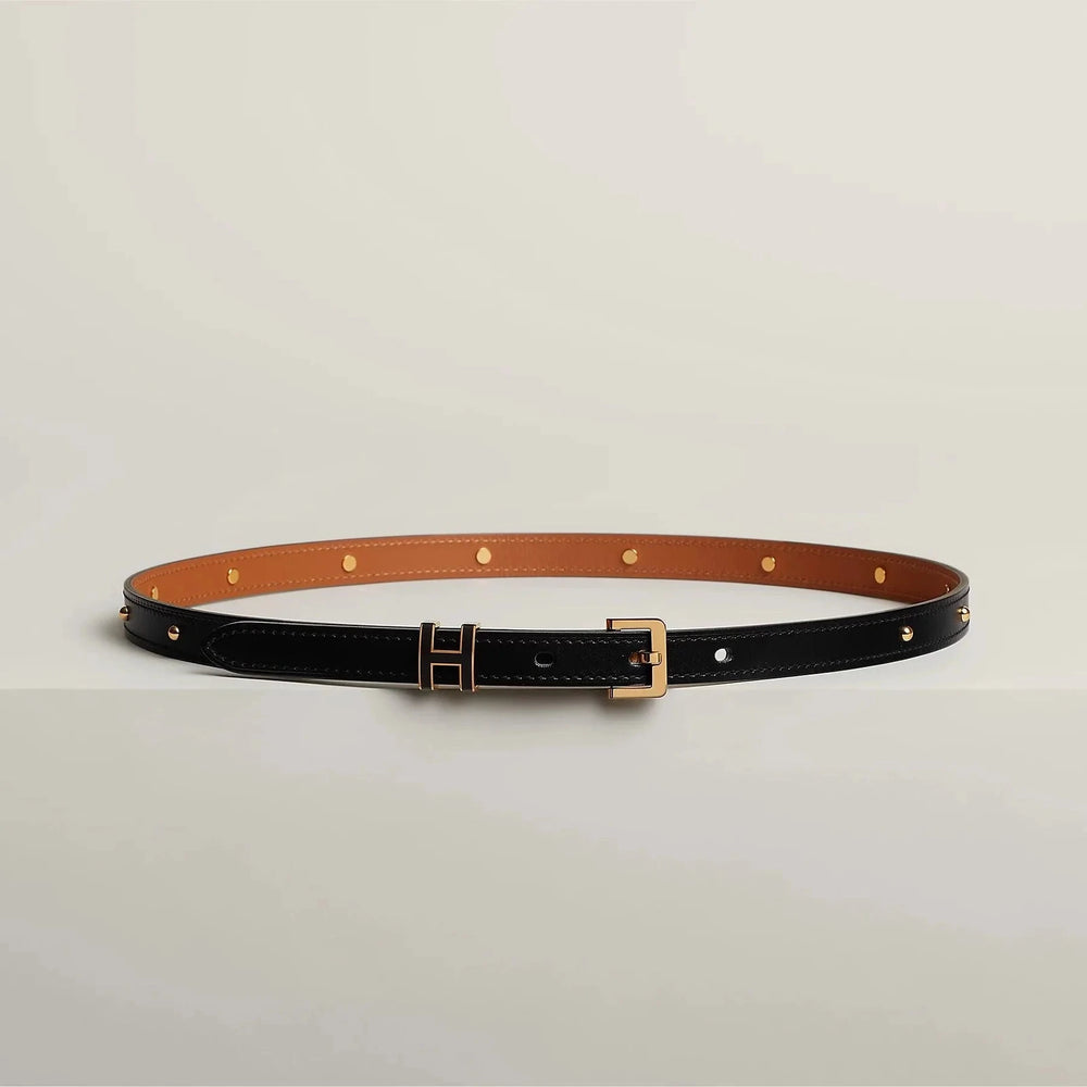 Luxury Hermes leather belt with sleek metallic buckle, premium craftsmanship.