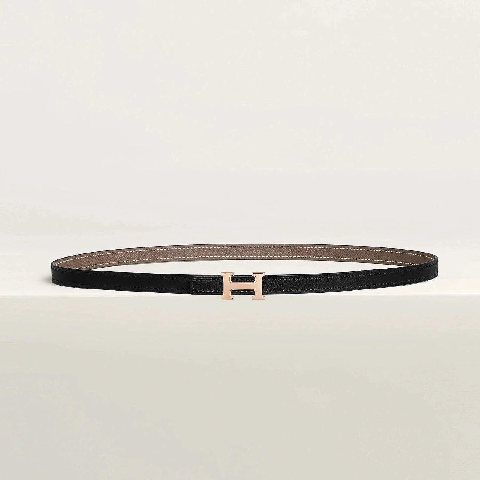 Image of Luxury Hermes reversible belt with elegant metallic buckle and premium leather finish.