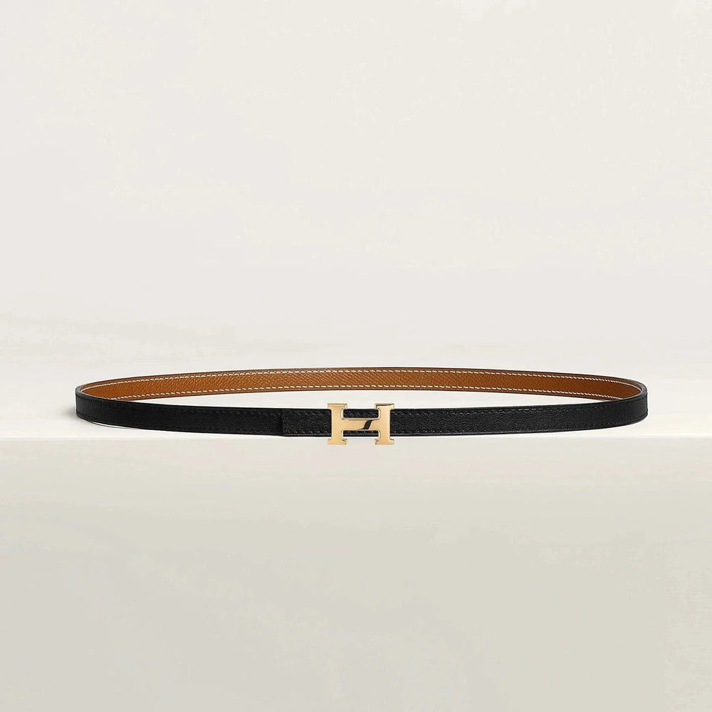 Hermes belt with gold metallic buckle, featuring high-quality leather and minimalist design.