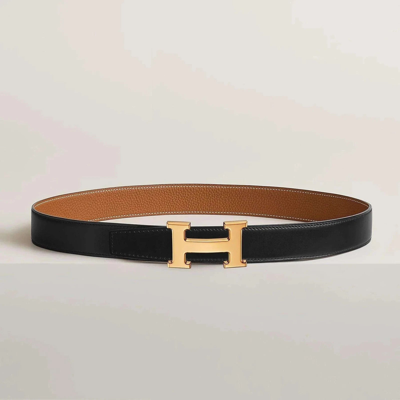 Image of Thick reversible leather belt with gold buckle.