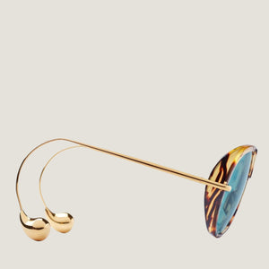 משקפי שמש B עם מסגרת מתכת מנומרת וברפידות אף מתכווננות.