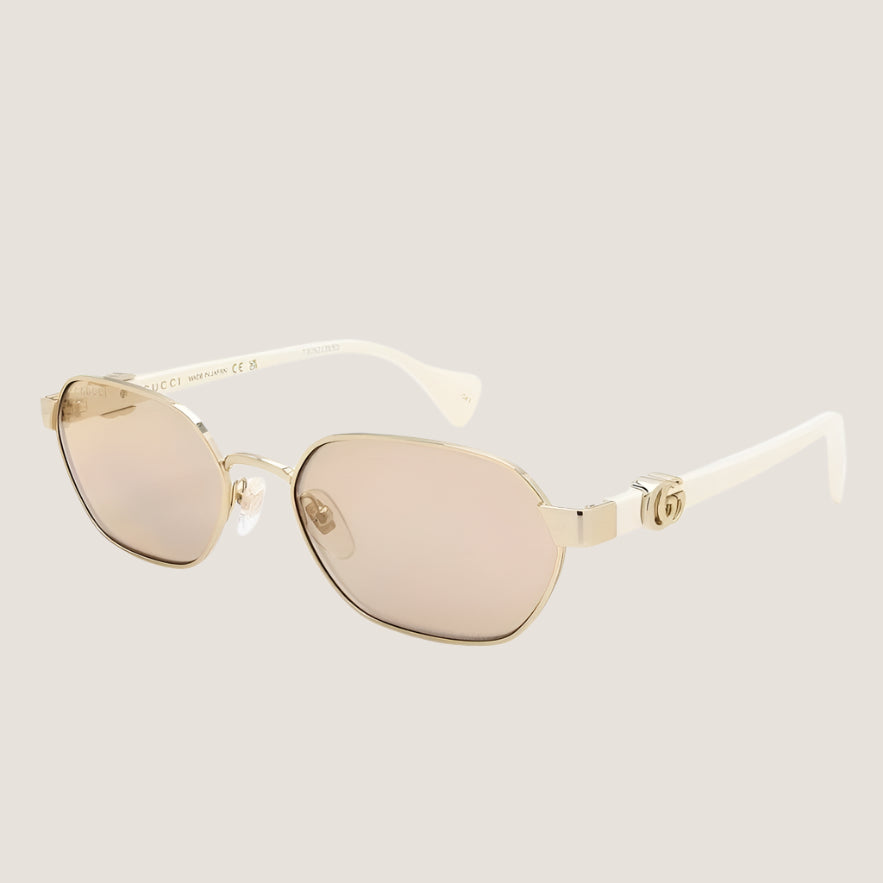 Iconic Gucci sunglasses with gold metallic frame and UV400 lenses, exuding luxury and modern chic style.