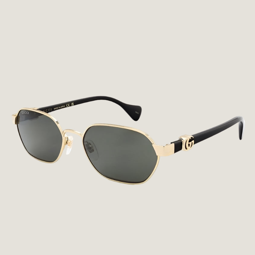 Gucci sunglasses with gold frames and dark lenses, featuring iconic GG logo on the arms.