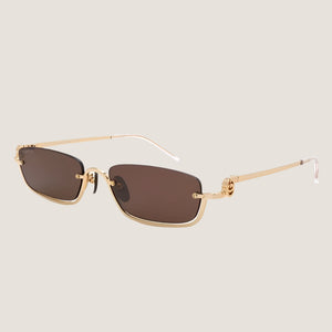 Rectangular GG sunglasses with brown lenses and gold metal frame.