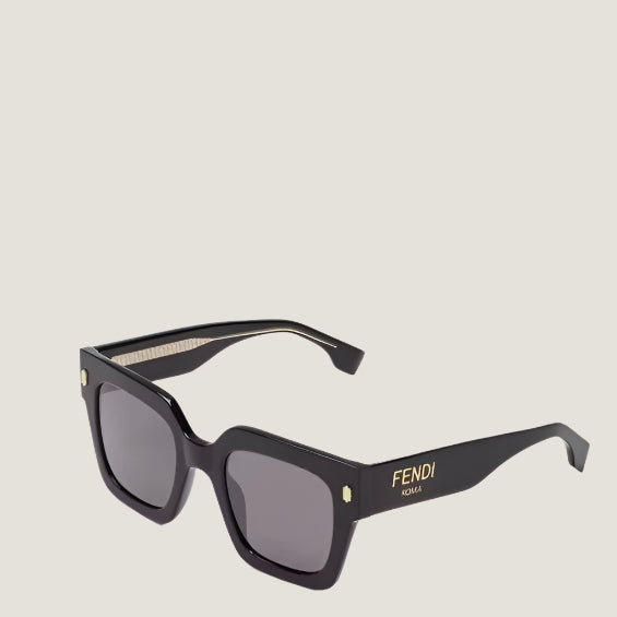 Image of Fendi sunglasses with black frame and UV400 lenses, featuring iconic Italian design.