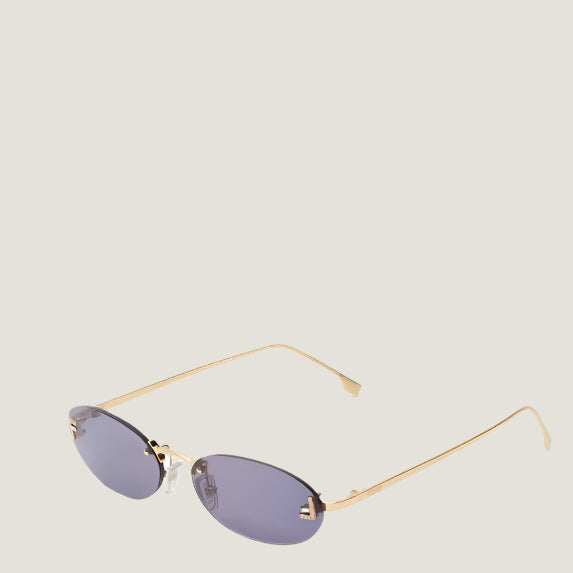 Fendi luxury sunglasses with oval lenses and gold frames.