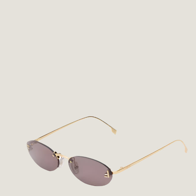 Image of Fendi luxury sunglasses with gold frame and dark lenses, UV400 protection.