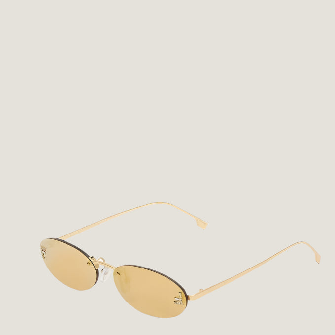 Fendi luxury sunglasses with gold frames and UV400 lenses.