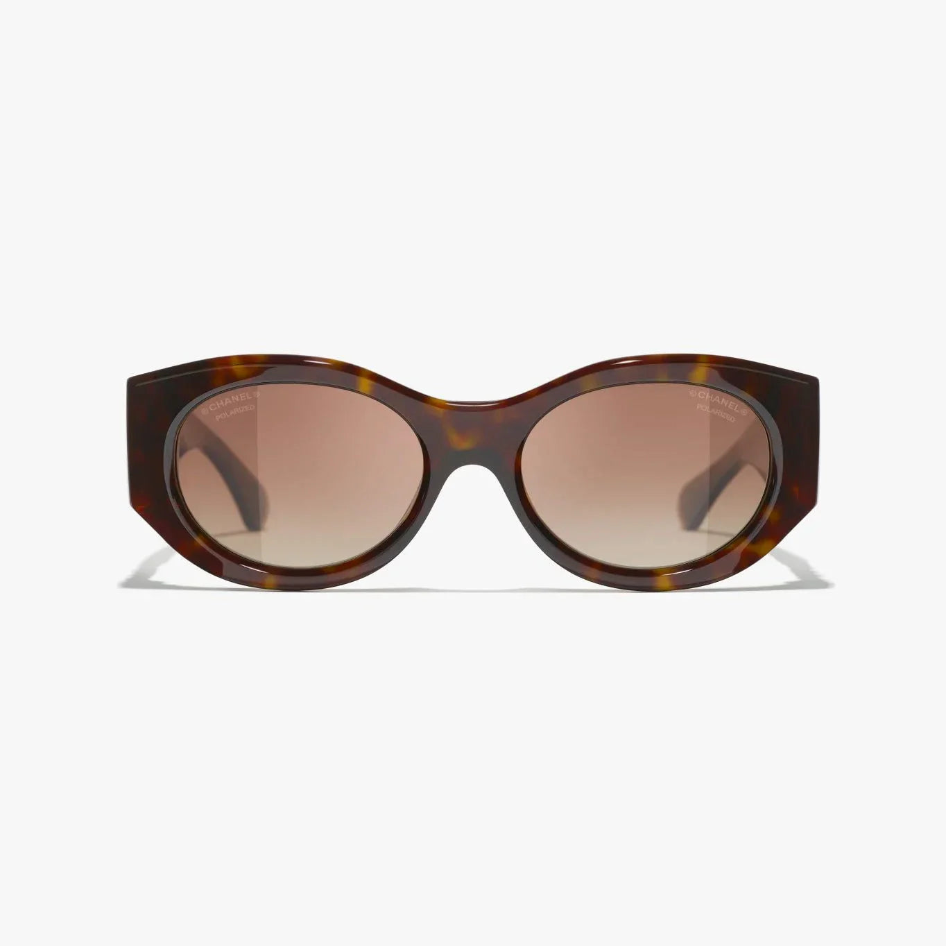 Image of CHANEL sunglasses with tortoiseshell pattern, plastic frame, 100% UVA/UVB protection.