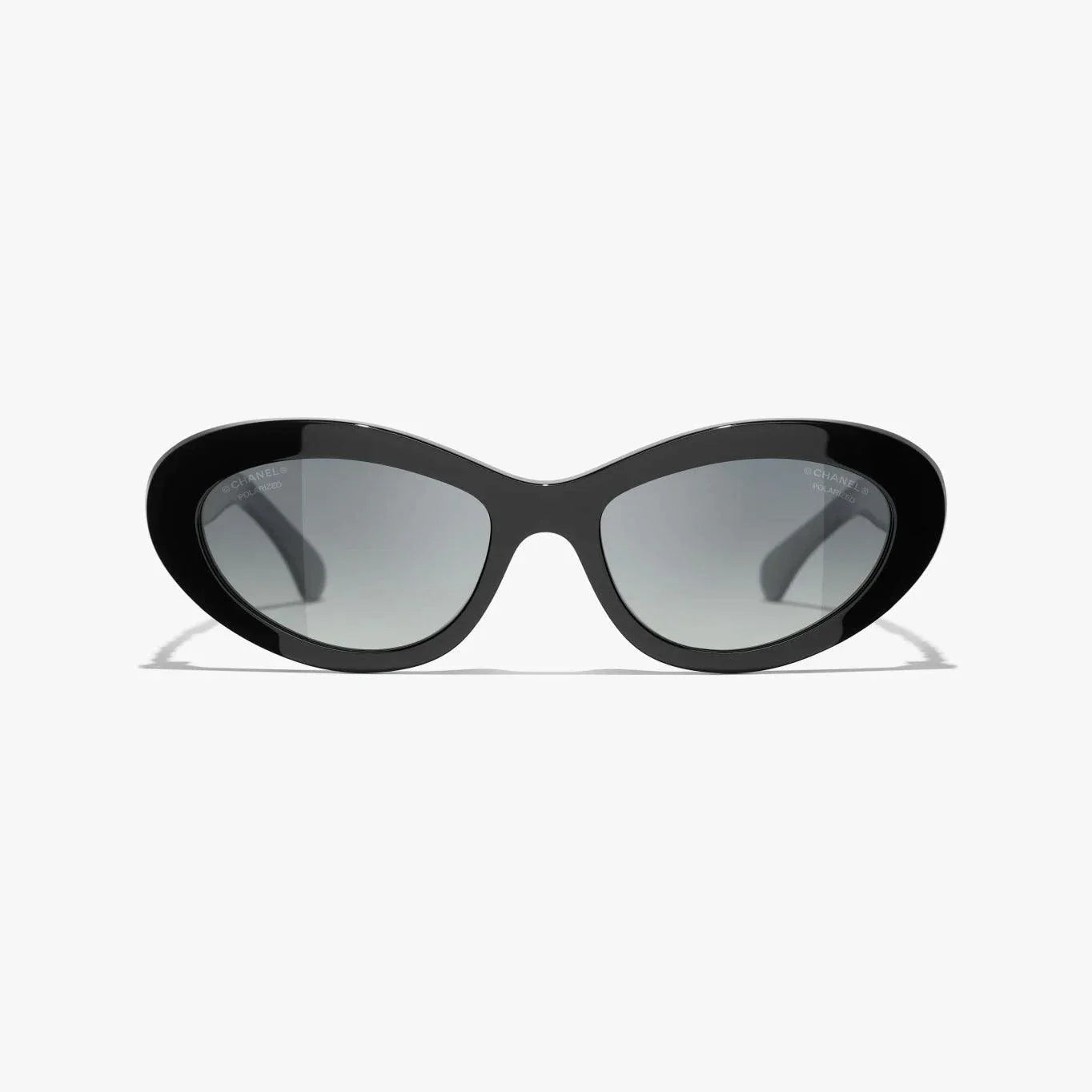 Image of CHANEL sunglasses with black and gold plastic frame, UVA/UVB protection.