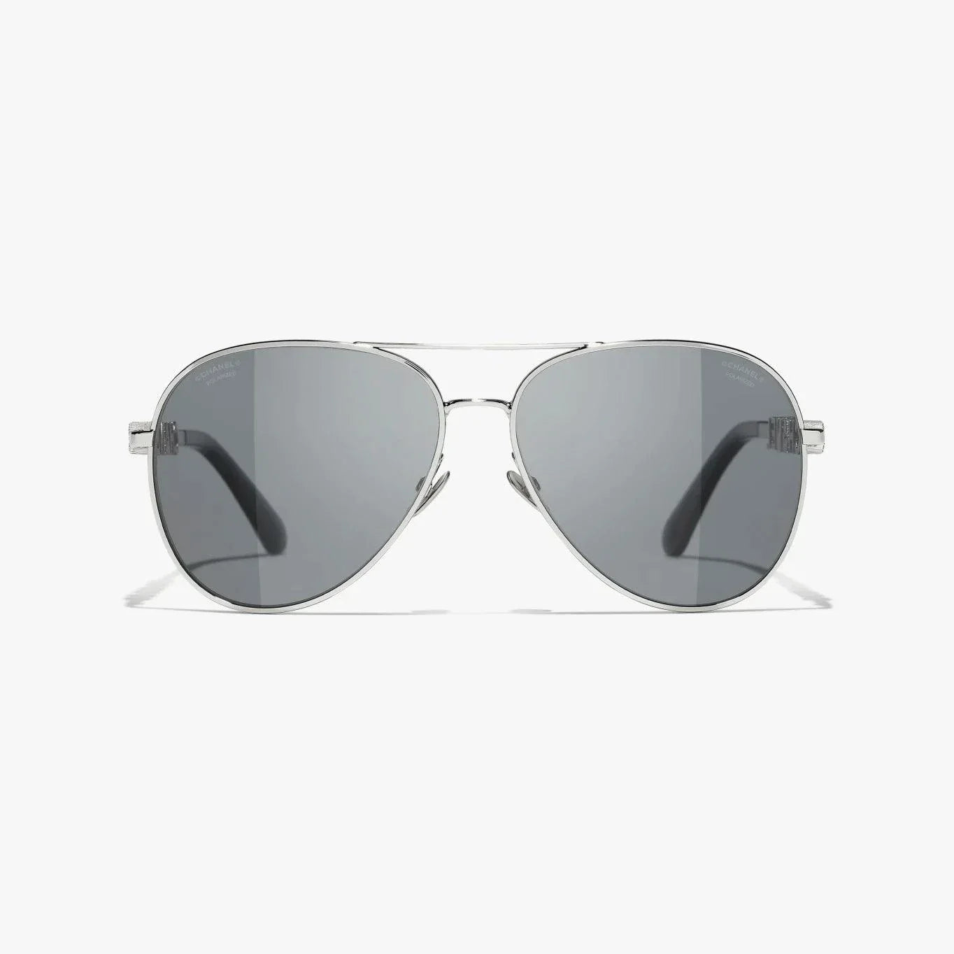 Image of Silver CHANEL sunglasses with plastic frame, UVA/UVB protection, adjustable nose pads.