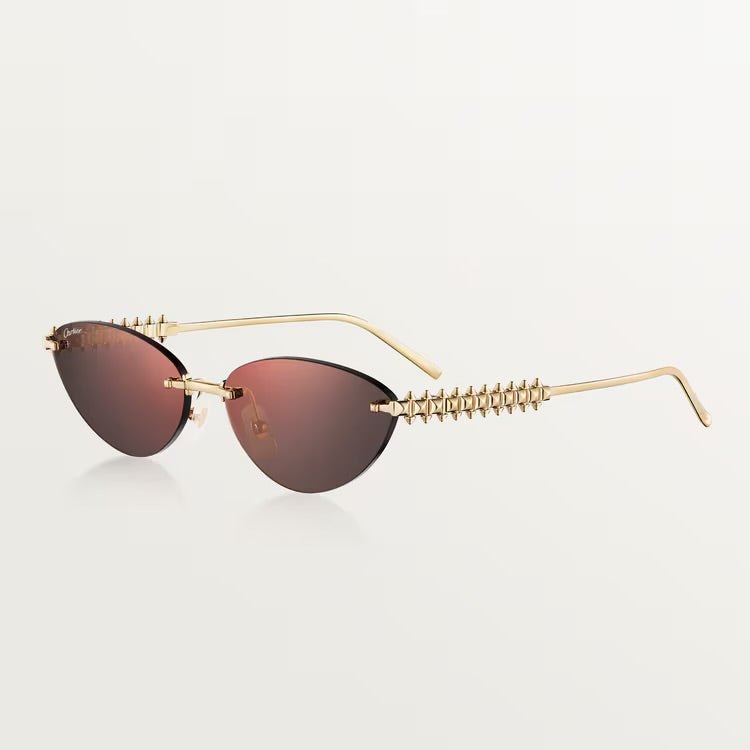 Image of Cartier luxury sunglasses with gold frame and UV400 dark lenses, unisex design.
