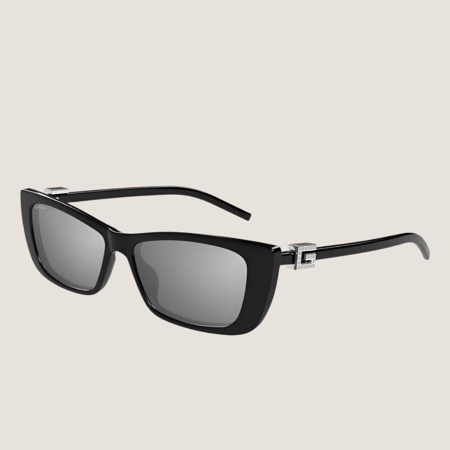 Gucci sunglasses with black frames and UV400 protection lenses.