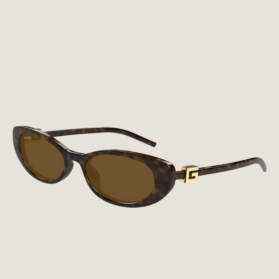 Image of משקפי שמש Gucci יוקרתיים בעיצוב איקוני עם עדשות UV400 ומסגרת דגם GG.