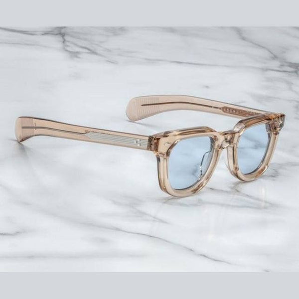 משקפי שמש Jacques Marie Mage מסגרת ניוד שקוף עם הגנה UVA/UVB, רפידות אף מתכווננות ועדשות ראיה.