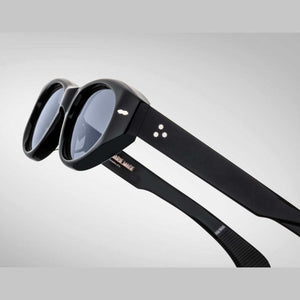 משקפי שמש Jacques Marie Mage KRASNER עם מסגרת פלסטיק שחורה, הגנה UVA/UVB ורפידות אף מתכווננות.