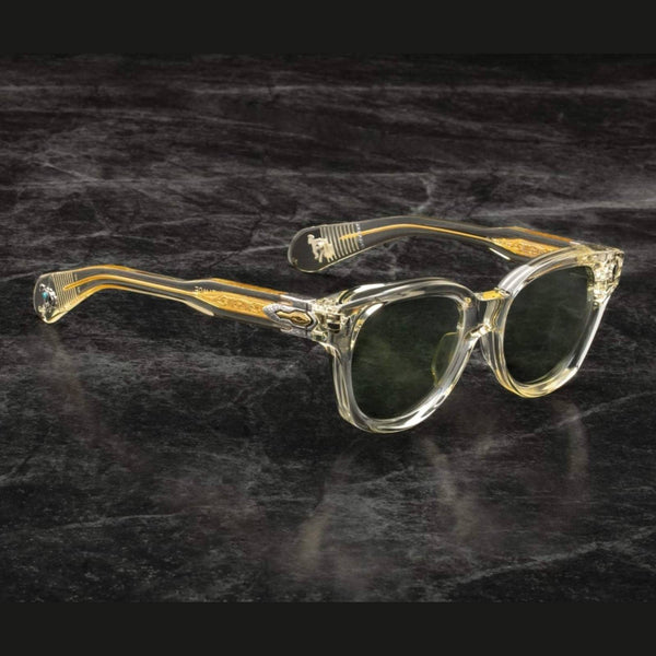 משקפי שמש Jacques Marie Mage MOJAVE עם מסגרת פלסטיק שקופה, רפידות אף מתכווננות, והגנה מלאה מפני UVA/UVB.